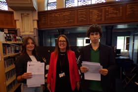 Headteacher, Mrs Watts, with Sofiia and Ivan, two students who achieved the highest grades in almost