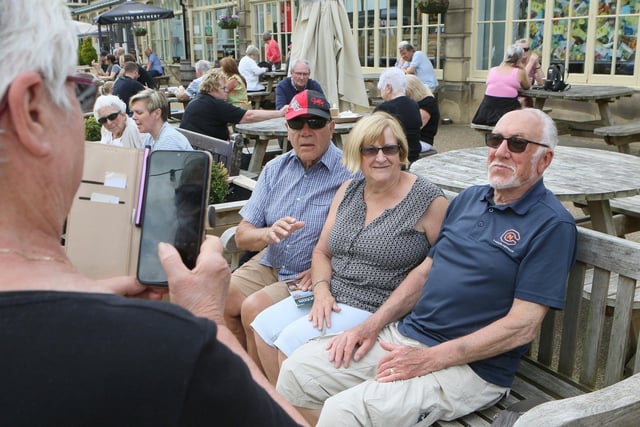 Visitors to Buxton's Pavilion Gardens smile for all the cameras. Pic Jason Chadwick