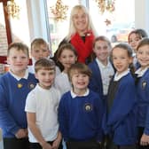 Head Jacquie Barber with the school council celebrating a good Ofsted report