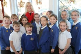 Head Jacquie Barber with the school council celebrating a good Ofsted report