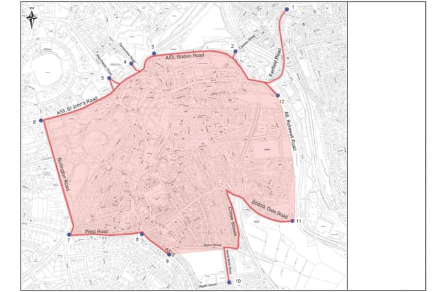 The area shaded red represents the proposed 20mph zone, with entry points marked by blue dots.