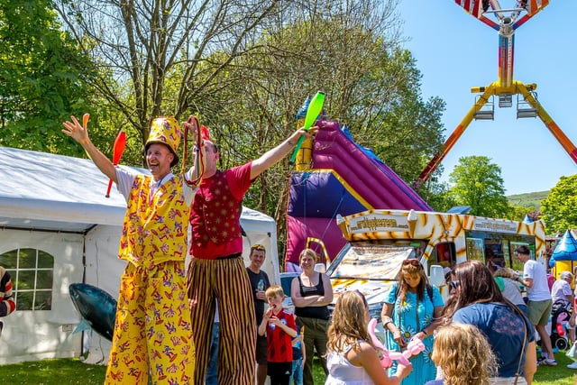 Stilt walkers towered over people at Hayfield May Queen. Picture Anthony McKeown