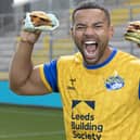 First men’s team captain of the Leeds Rhinos, Kruise Leeming, ‘try-s and tastes’ new Deliveroo x Hooyah Burgers exclusive Leeds Rhinos burger ahead of its launch on National Burger Day, August. 25 (photo: Doug Jackson/PinPep)