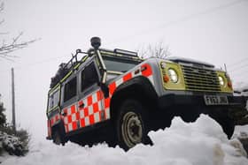 An ambulance attended after a car, with a driver and two passengers on board, went through a wall after skidding on ice in Peak District.