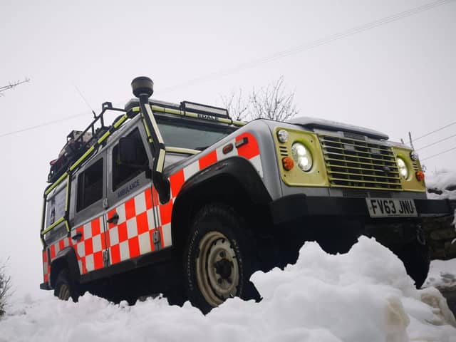 An ambulance attended after a car, with a driver and two passengers on board, went through a wall after skidding on ice in Peak District.