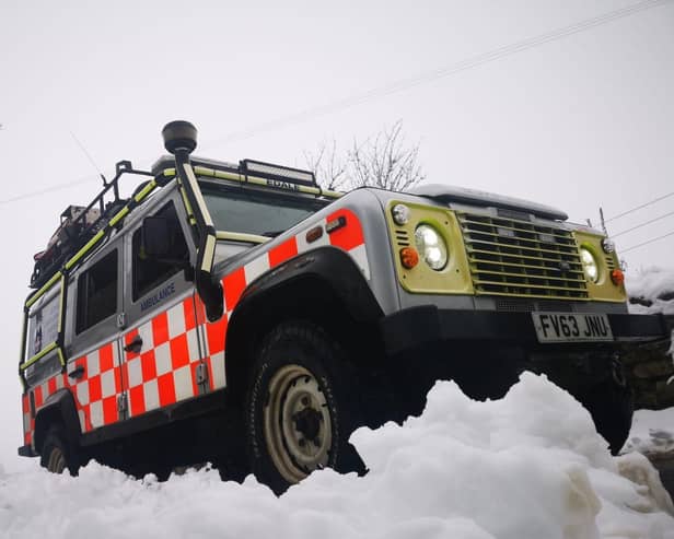An ambulance attended after a car, with a driver and two passengers on board, went through a wall after skidding on ice in Peak District.