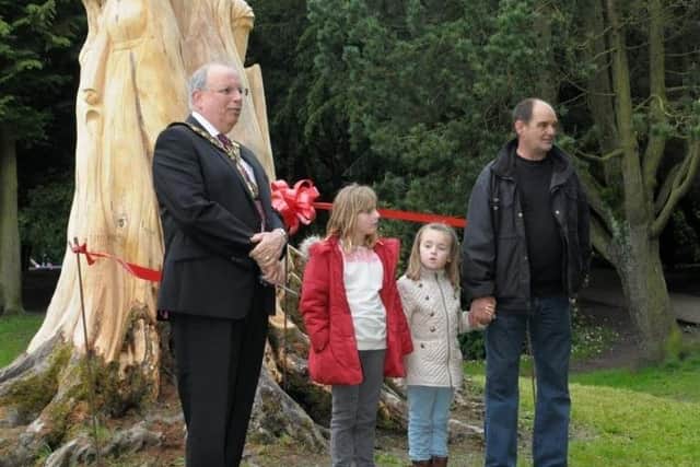 The official opening of the tree sculpture in Pavilion Gardens in June 2014 by Mayor Alan Barrow and Trevor Zoppi with help from Danielle Shore and Savannah Zoppi. Photo contributed.