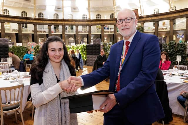 Amy Brittain-Cartlidge receives her award from Buxton & Leek College Principal Len Tildsley