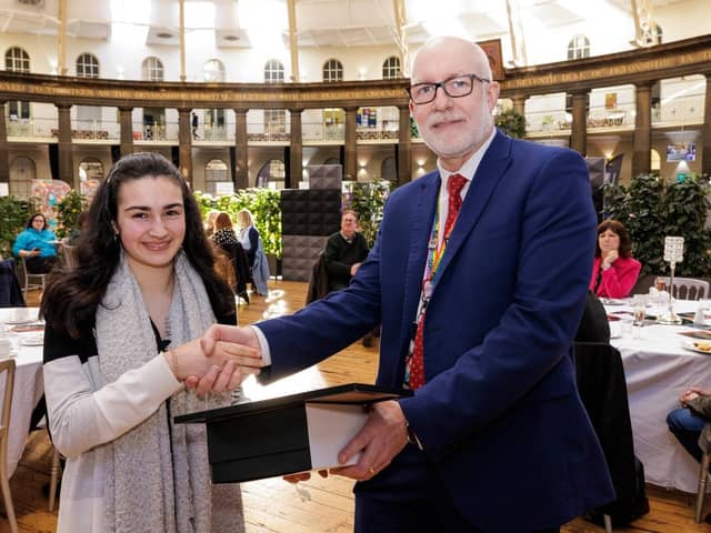 Amy Brittain-Cartlidge  receives her award from Buxton & Leek College Principal Len Tildsley