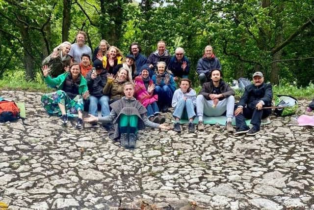 Rachel Elnaugh, front row, third from left, with some of her group's members after they had cleared a limestone reservoir on the land.