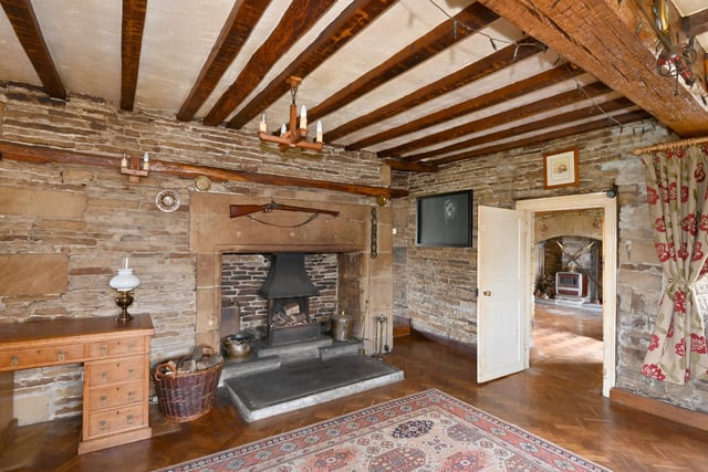 Immense fireplaces and solid wood beams are among the many character features of the seventeenth century property.