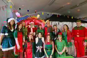 Santa and his team of elves at the Buxton grotto on Sunday. Photo submitted