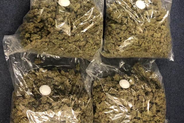 Bags of what is believed to be cannabis worth £50,000 were discovered during the early morning raids in Simmondley and Glossop, Derbyshire