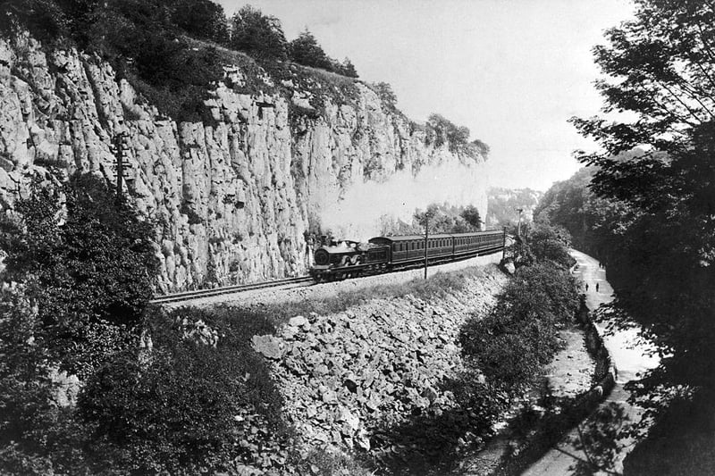 A steam train passes along the Buxton branch of the Midland Railway in Derbyshire, circa 1910.