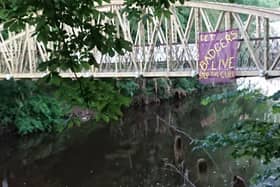 'Stop the cull' sign at Jubilee Bridge, Matlock Bath