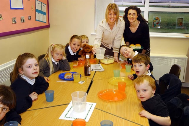 Serving up a breakfast of bacon, sausages and scrambled egg at the Thorney Close Primary School breakfast club in 2003.