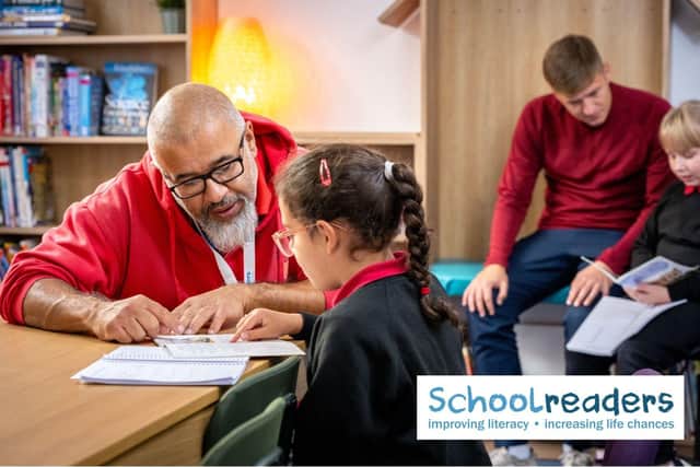 Schoolreaders volunteers listening to children read