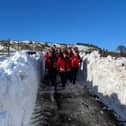 Buxton Mountain rescue team walking through the cleared snow drift. Pic submitted