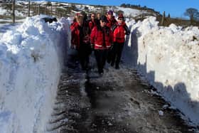 Buxton Mountain rescue team walking through the cleared snow drift. Pic submitted