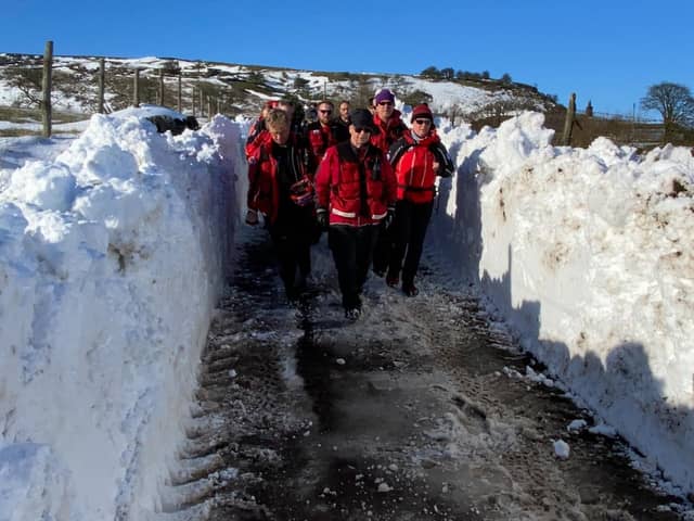 Buxton Mountain rescue team walking through the cleared snow drift. Pic submitted