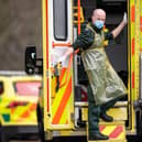 A London Ambulance Service worker is seen in the back of an ambulance (Photo by Justin Setterfield/Getty Images)