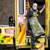 A London Ambulance Service worker is seen in the back of an ambulance (Photo by Justin Setterfield/Getty Images)