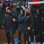 Morecambe manager Steve Robinson gives his side instructions during the FA Cup win over Buxton. He is now hoping for a glamour third round draw.