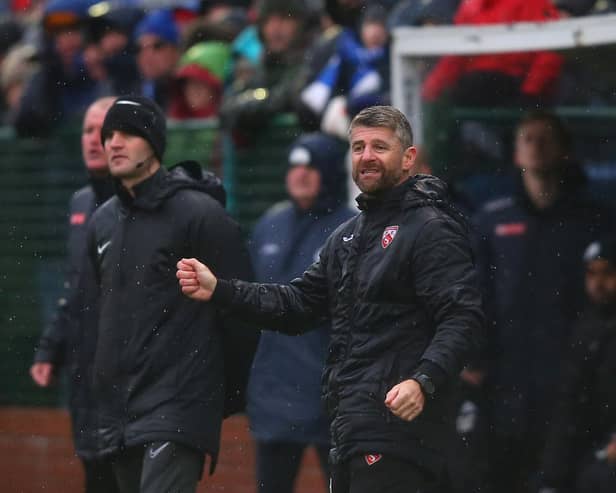 Morecambe manager Steve Robinson gives his side instructions during the FA Cup win over Buxton. He is now hoping for a glamour third round draw.