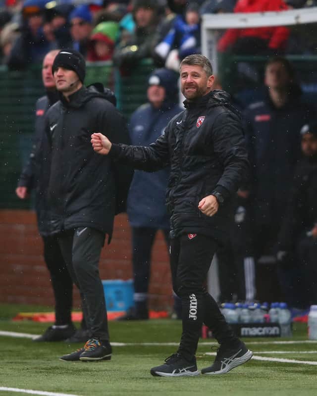 Morecambe manager Steve Robinson gives his side instructions during the FA Cup win over Buxton. He is now hoping for a glamour third round draw.