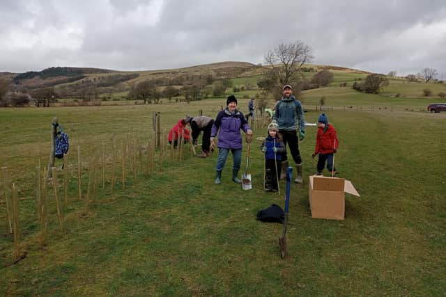 Volunteers from Hope Valley Climate Action planting the new hedgerow at Marsh Farm.