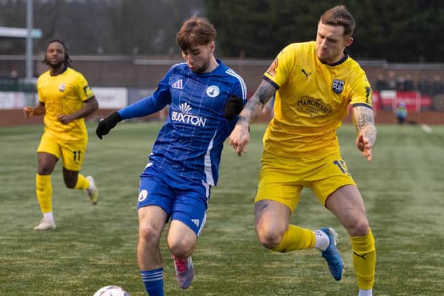 Cian Coleman in possession for Buxton against Radcliffe. Photo: Phil Peat Photography.