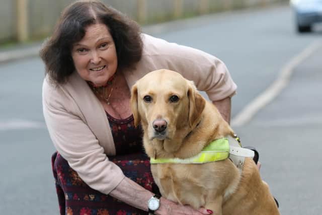 Sarah Wynn-Jones pictured with her now retired guide dog Ushi.