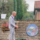 The unveiling of one of the new mosaics in Townend Community Garden. Photo dubbm