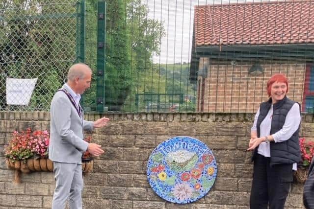 The unveiling of one of the new mosaics in Townend Community Garden. Photo dubbm