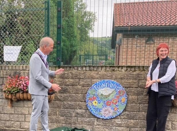The unveiling of one of the new mosaics in Townend Community Garden. Photo dubbm