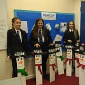 Buxton Community School students with the snowmen they made