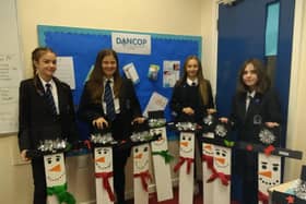 Buxton Community School students with the snowmen they made