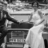 Jack and Kennedy pose on their Land Rover after the wedding.