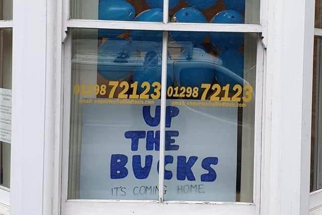 Buxton business Allied Taxis have decorated their windows in support of the Bucks