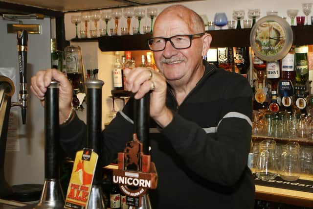 Terry Wild behind the bar forty years after taking on the Fox Inn