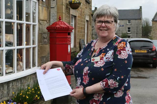 Sue Bruce, village postmistress at Hartington with the letter she received from the Post Office.
