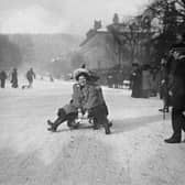 A local is pictured Tobogganing in the snow at Buxton in around 1904..