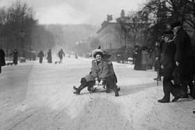 A local is pictured Tobogganing in the snow at Buxton in around 1904..