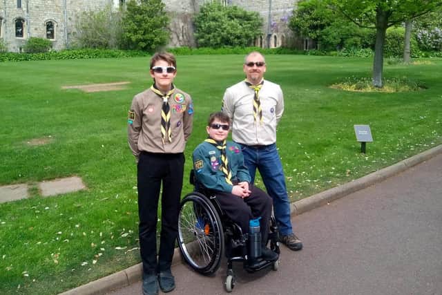 Peter Berriman, brother Sam and dad Martin at Windsor Castle after Peter was awarded  the Chief Scout's Commendation for Meritorious Conduct award.