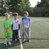 Three youngsters get ready to play at Buxton.