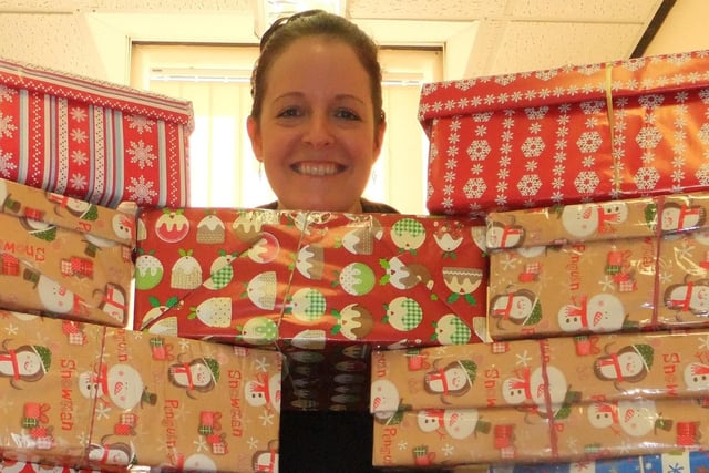 Ali Baker, PA to the CEO/Chairman & Office Manager, at Derbyshire Healthcare NHS Foundation Trust with the shoeboxes collected for Operation Christmas Child in 2012. Photo contributed.