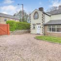Greggs Cottage on Manchester Road, Chapel-en-le-Frith has large lawns to the side of it.