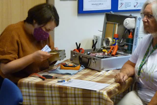 Some of the repairers working hard the the first Transition New Mills Repair Cafe since lockdown