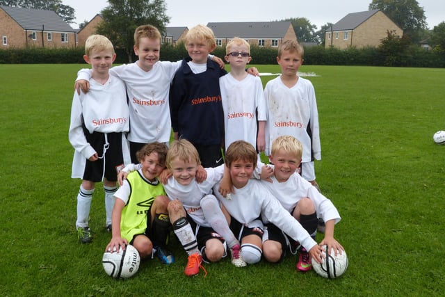 Buxton JFC Lions and Ninjas Under-8s in their training kit sponsored by Sainsbury's.