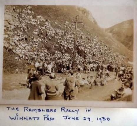 Archive photo of a Ramblers rally with members lining the slopes of Winnats Pass in 1930.